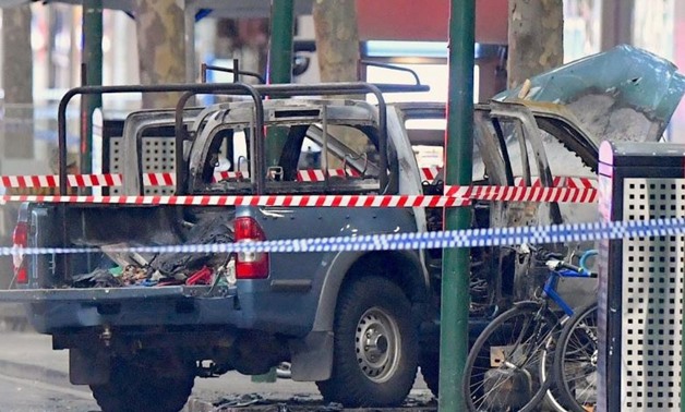 A burnt out vehicle is surrounded by police tape on Bourke Street in central Melbourne, Australia, November 9, 2018. AAP/James Ross/via REUTERS
