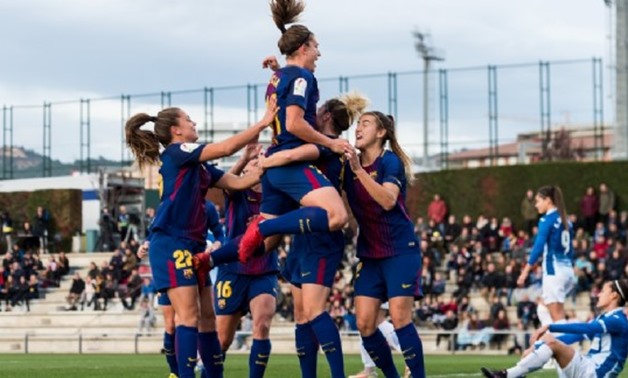 FILE - Barcelona women’s team celebrates scoring against Espanyol at Catalan Derby 