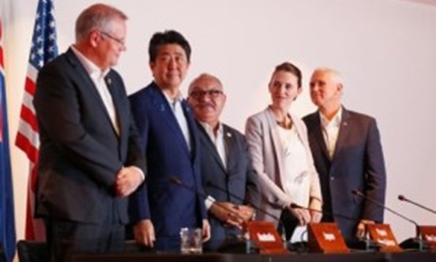 Papua New Guinea's Prime Minister Peter O' Neill, U.S. Vice President Mike Pence, Australia's Prime Minister Scott Morrison, New Zealand's Prime Minister Jacinda Ardern look at Japan's Prime Minister Shinzo Abe during the signing of a joint electricity de