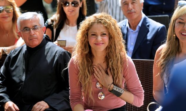 FILE PHOTO: Colombian singer Shakira reacts during her visit to Tannourine Cedars Reserve, in Tannourine, Lebanon July 13, 2018. REUTERS/Jamal Saidi.