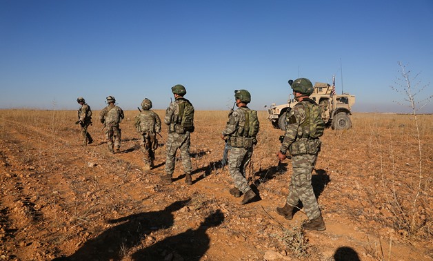 U.S. and Turkish soldiers conduct the first-ever combined joint patrol outside Manbij, Syria, November 1, 2018. Picture taken November 1, 2018. Courtesy Arnada Jones/U.S. Army/Handout via REUTERS ATTENTION EDITORS - THIS IMAGE HAS BEEN SUPPLIED BY A THIRD