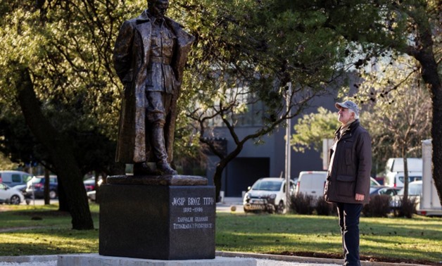 A man looks at the monument of late Yugoslav leader Josip Broz Tito in Podgorica, Montenegro, December 18, 2018. Picture taken December 18, 2018. REUTERS/Stevo Vasiljevic
