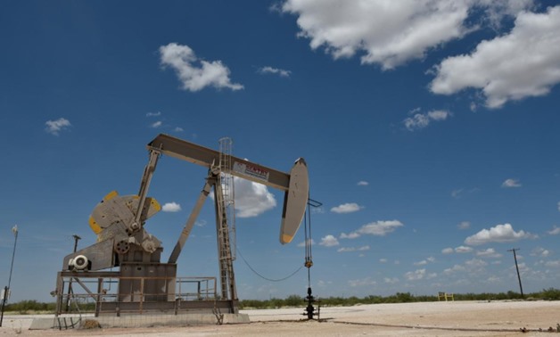 FILE PHOTO: A pump jack operates in the Permian Basin oil production area near Wink, Texas U.S. August 22, 2018. Picture taken August 22, 2018. REUTERS/Nick Oxford/File Photo
