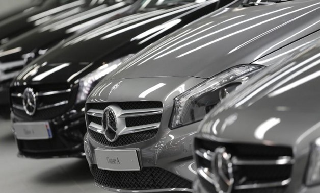 Mercedes-Benz A-class cars are displayed in a dealership of German car manufacturer Daimler in Paris, July 30, 2013. REUTERS/Christian Hartmann