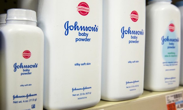 FILE PHOTO: Bottles of Johnson & Johnson baby powder line a drugstore shelf in New York October 15, 2015. REUTERS/Lucas Jackson