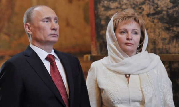 Vladimir Putin (L) and his wife Lyudmila attend a service - REUTERS/Aleksey Nikolskyi/RIA Novosti