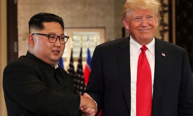 FILE PHOTO: U.S. President Donald Trump and North Korea's leader Kim Jong Un shake hands after signing documents during a summit at the Capella Hotel on the resort island of Sentosa, Singapore, June 12, 2018. REUTERS/Jonathan Ernst/File Photo

