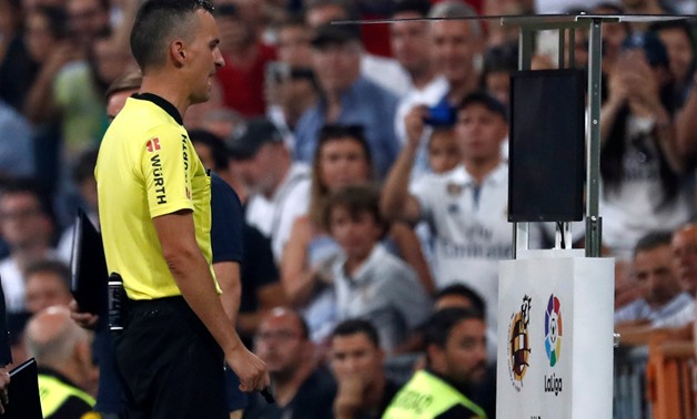 FILE PHOTO: La Liga Referee checks VAR at Santiago Bernabeu, Madrid, Spain - September 1, 2018. REUTERS/Javier Barbancho/File Photo
