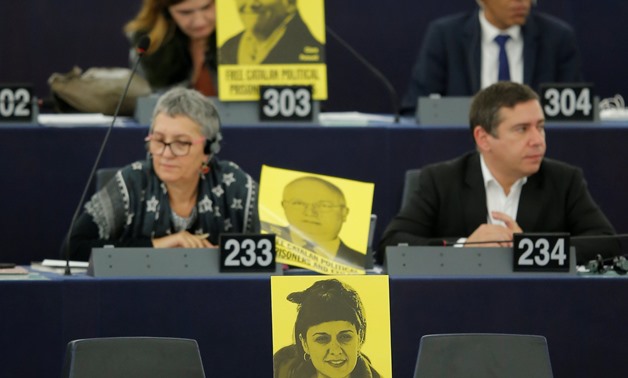 Posters with the slogan "free Catalan political prisoners and exiles" are seen on the desks of Members of the European Parliament during Spanish Prime Minister Pedro Sanchez's speech at the European Parliament in Strasbourg, France, January 16, 2019. REUT