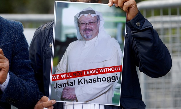  FILE PHOTO: A demonstrator holds picture of Saudi journalist Jamal Khashoggi during a protest in front of Saudi Arabia's consulate in Istanbul, Turkey, October 5, 2018. REUTERS/Osman Orsal