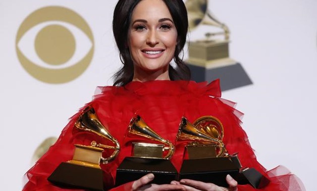 61st Grammy Awards - Photo Room - Los Angeles, California, U.S., February 10, 2019 - Kacey Musgraves poses backstage with her four awards, including for Album of the Year for "Golden Hour." REUTERS/Mario Anzuoni.