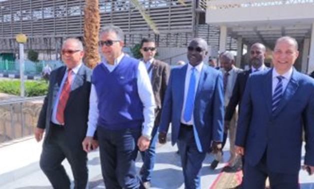 Egyptian Transport Minister Hisham Arafat and his Sudanese counterpart Hatim Al Sir Ali during their tour in Aswan - Press Photo