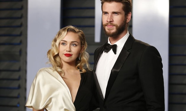 2018 Vanity Fair Oscar Party – Arrivals – Beverly Hills, California, U.S., 04/03/2018 – Singer Miley Cyrus and actor Liam Hemsworth. REUTERS/Danny Moloshok.
