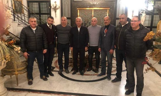 Hossam Hassan and Ibrahim Hassan with Smouha's board headed by Farag Aamer - FILE
