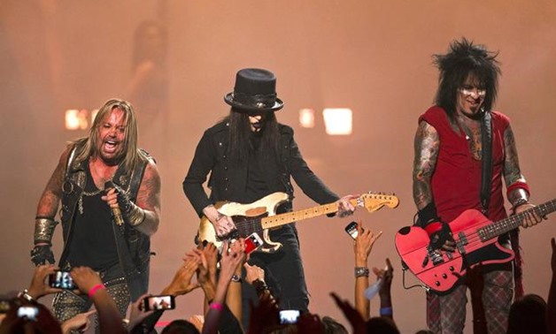 Motley Crue band members Vince Neil (L), Mick Mars (C), and Nikki Sixx perform during the 2014 iHearRadio Music Festival in Las Vegas, Nevada, September 19, 2014. REUTERS/Steve Marcus/File Photo