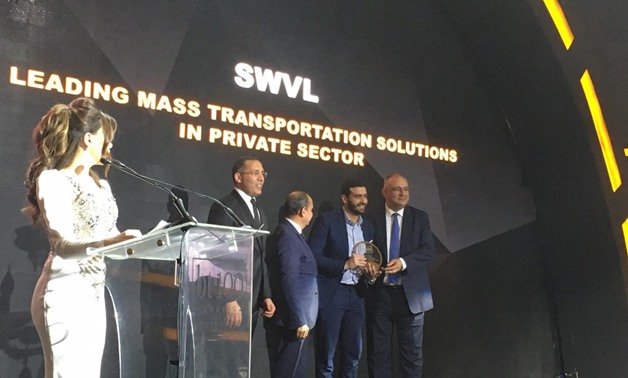Mostafa Kandil, Co-founder and CEO of Swvl, SWVL, receiving the bt100 crystal award on behalf of SWVL