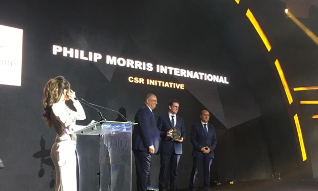 Dominique Thollon, Chief Finance Officer of Philip Morris International, receiving the bt100 crystal award
