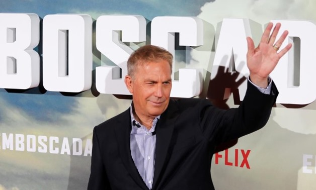 Actor Kevin Costner waves during a photocall to promote his latest film "The Highwaymen" in Madrid, Spain, March 25, 2019. Picture taken March 25, 2019. REUTERS/Sergio Perez