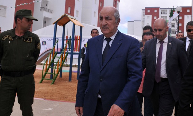 Algerian Housing minister Abdelmadjid Tebboune (C) is seen during the ceremony of social housing distribution - REUTERS/ Ramzi Boudina