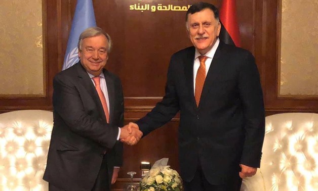 Libyan Prime Minister Fayez al-Sarraj shakes hands with Secretary General of the United Nations Antonio Guterres during the meeting in Tripoli, Libya April 4, 2019. The Media Office of the Prime Minister/Handout via REUTERS