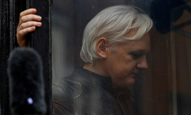 FILE PHOTO: WikiLeaks founder Julian Assange is seen on the balcony of the Ecuadorian Embassy in London, Britain, May 19, 2017. REUTERS/Peter Nicholls
