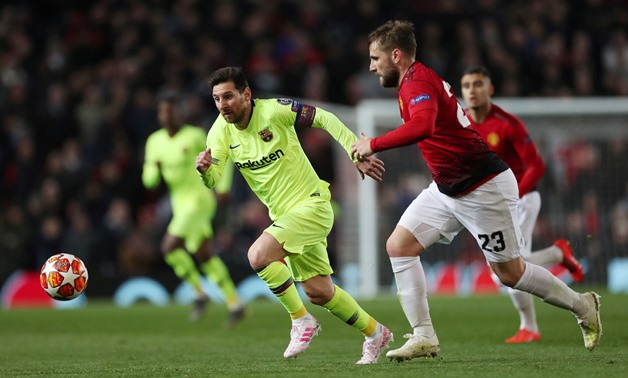 Soccer Football - Champions League Quarter Final First Leg - Manchester United v FC Barcelona - Old Trafford, Manchester, Britain - April 10, 2019 Barcelona's Lionel Messi in action with Manchester United's Luke Shaw Action Images via Reuters/Lee Smith