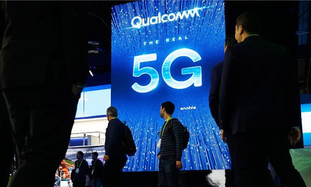 In this Jan. 9, 2019, file photo a sign advertises 5G at the Qualcomm booth at CES International in Las Vegas. (AP)
