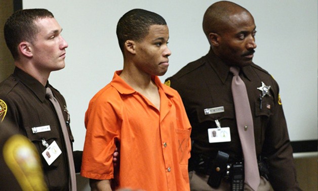 Eighteen-year old sniper suspect Lee Malvo, (C), who was 17 at the time of the alleged crimes, appears in court during the trial of sniper suspect John Muhammad in Virginia Beach, Virginia, U.S., October 22, 2003. REUTERS/Davis Turner/Pool/Files
2017-05 