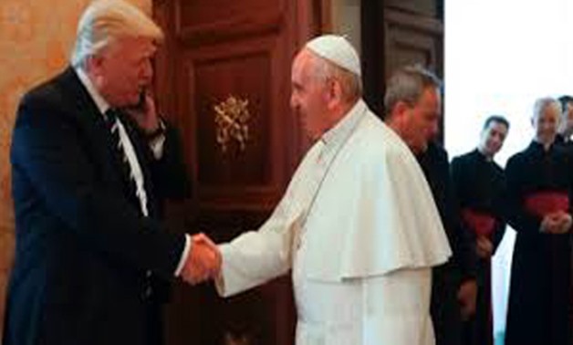 Trump and pope Francis-file photo