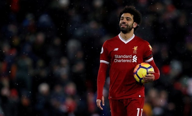 File- March 17, 2018 Liverpool's Mohamed Salah celebrates with the match ball after the match Action Images via Reuters/Lee Smith