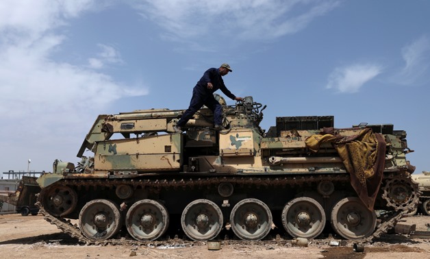 A military technician of the Iraqi Popular Mobilisation Forces (Hashid Shaabi) repairs a tank, damaged by war, at a workshop in Kerbala, Iraq May 7, 2019. Picture taken May 7, 2019. REUTERS/Abdullah Dhiaa Al-Deen
