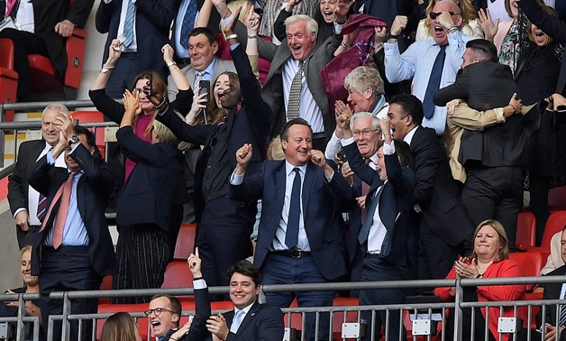 Soccer Football - Championship Playoff Final - Aston Villa v Derby County - Wembley Stadium, London, Britain - May 27, 2019 Former UK Prime Minister David Cameron celebrates in the stands after the match Action Images via Reuters/Tony O'Brien
