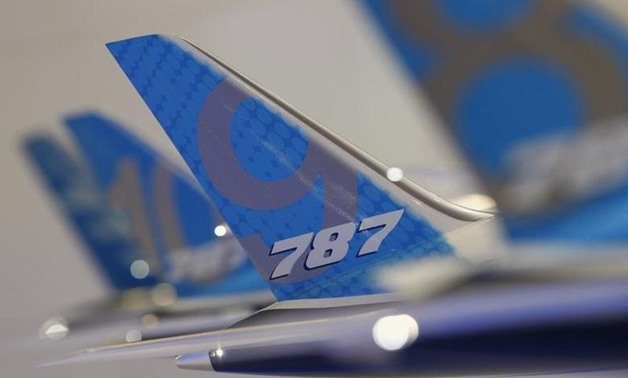The tailwing of a model Boeing 787 Dreamliner aircraft is pictured at the Boeing booth at the Singapore Airshow February 11, 2014. REUTERS/Edgar Su