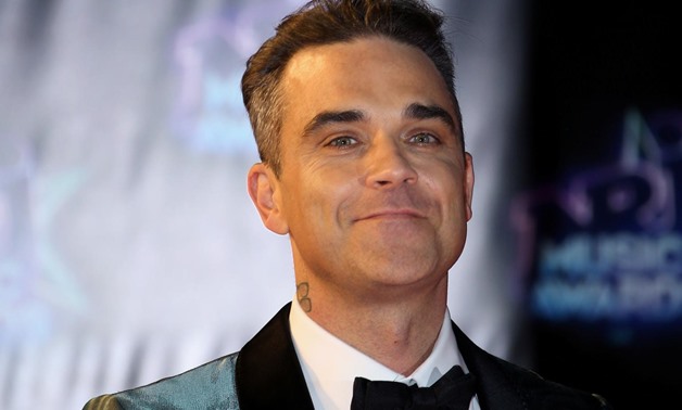 Pop singer Robbie Williams mentored a choir from LMA on The X Factor and said he enjoyed the experience. PHOTO: REUTERS