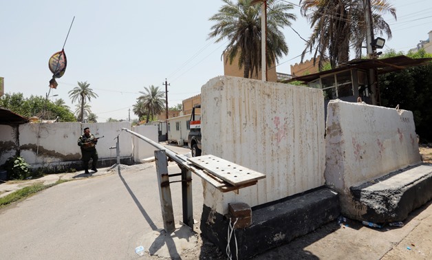 Iraqi security forces stand guard outside Bahraini embassy in Baghdad, Iraq, June 28, 2019. REUTERS/Thaier al-Sudani
