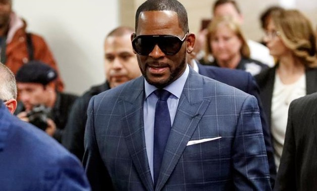 FILE PHOTO: Grammy-winning R&B singer R. Kelly arrives for a child support hearing at a Cook County courthouse in Chicago, Illinois, U.S. March 6, 2019. REUTERS/Kamil Krzaczynski/File Photo.