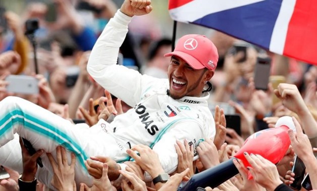 Formula One F1 - British Grand Prix - Silverstone Circuit, Silverstone, Britain - July 14, 2019 Mercedes' Lewis Hamilton celebrates with the crowd after winning the race REUTERS/Matthew Childs
