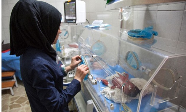 This file picture shows a Syrian nurse standing next to incubators with newborns at a children's hospital on June 9, 2016 (AFP Photo)
