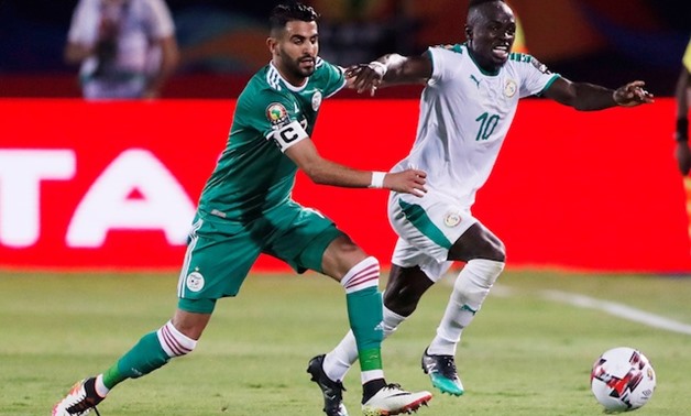 Senegal's Sadio Mane in action with Algeria's Riyad Mahrez. Reuters