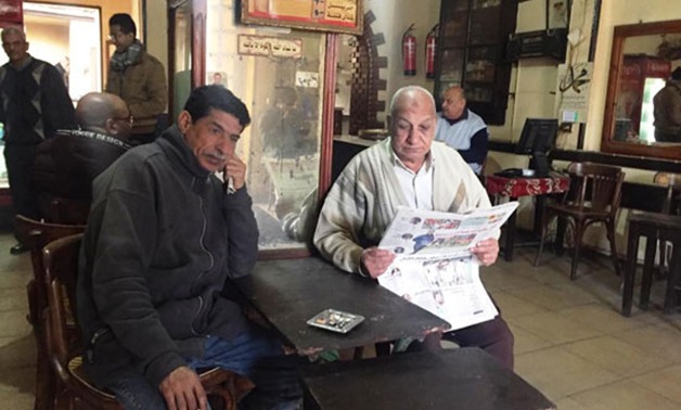 FILE - Men sitting on a cafe in Egypt 