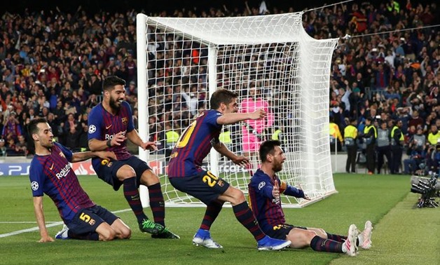 Lionel Messi celebrates scoring against Liverpool, Reuters 