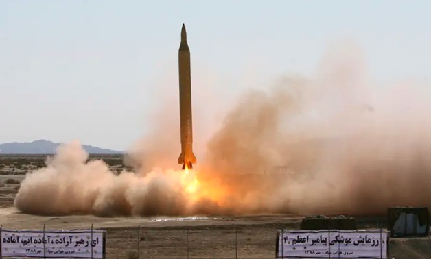 A Ghadr 1 class Shahab 3 long-range missile is prepared for launch during a test from an unknown location in central Iran. (photo credit: REUTERS)