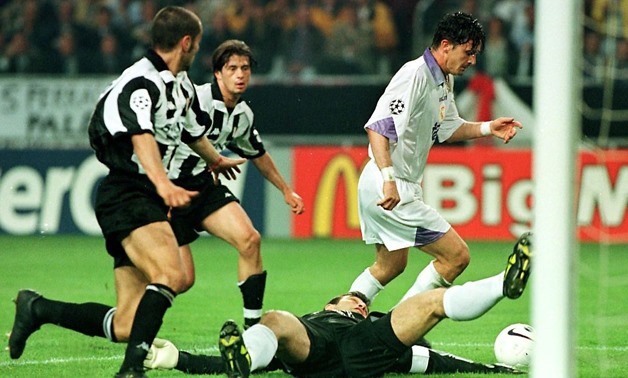 Real Madrid's Predrag Mijatovic (right) dribbles around Juventus goalie Angelo Peruzzi as he scores the winning goal in their 1998 Champions League final in Amsterdam - AFP/Marcel Antonisse