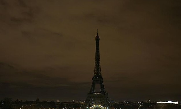 The Eiffel Tower had already turned its lights off on Tuesday night after a series of suicide blasts in Baghdad killed at least 42 - AFP