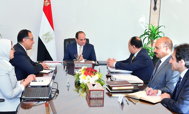 President Abdel Fatah al-Sisi met with a number of ministers on Wednesday to discuss several files including the newly implemented health insurance system - Press Photo