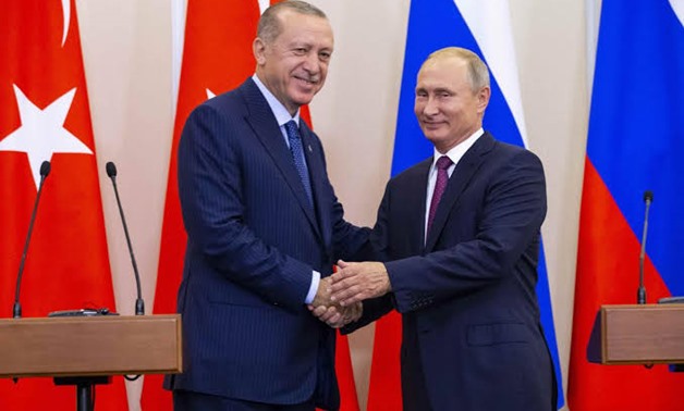Russian President Vladimir Putin (R) and his Turkish counterpart Tayyip Erdogan shake hands during a news conference following their talks in Sochi, Russia September 17, 2018. Alexander Zemlianichenko/Pool via REUTERS
