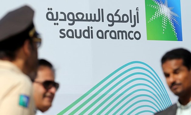 The logo of Aramco is seen as security personnel stand before the start of a press conference by Aramco at the Plaza Conference Center in Dhahran, Saudi Arabia November 3, 2019. REUTERS/Hamad I Mohammed
