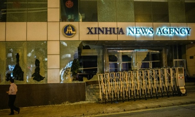Hardcore demonstrators in Hong Kong smashed the windows of Chinese state-run news agency Xinhua
