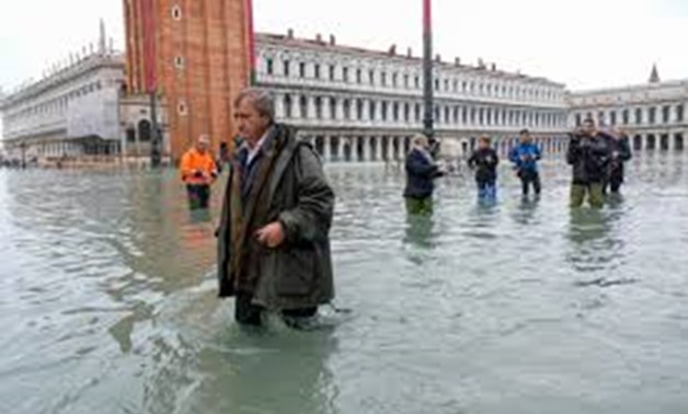 The Mayor of Venice Luigi Brugnaro walks on St Mark's Square during an exceptionally high water levels in Venice, Italy November 13, 2019. REUTERS/Manuel Silvestri
