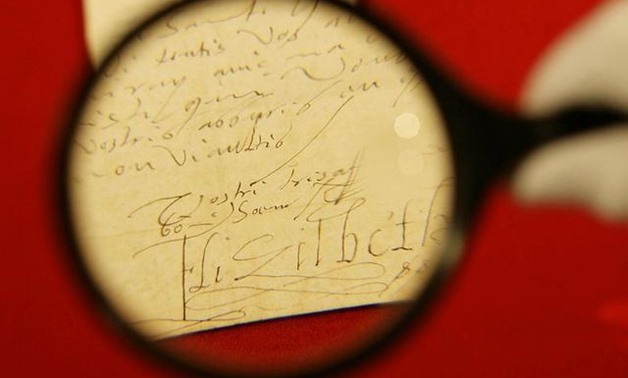 FILE PHOTO: A letter written by Queen Elizabeth I of England is inspected at Christies auctioneers in London before its sale June26, 2007. The auction of The Albin Schram Collection of Autograph Letters will be held in London in July. REUTERS/James Boardm